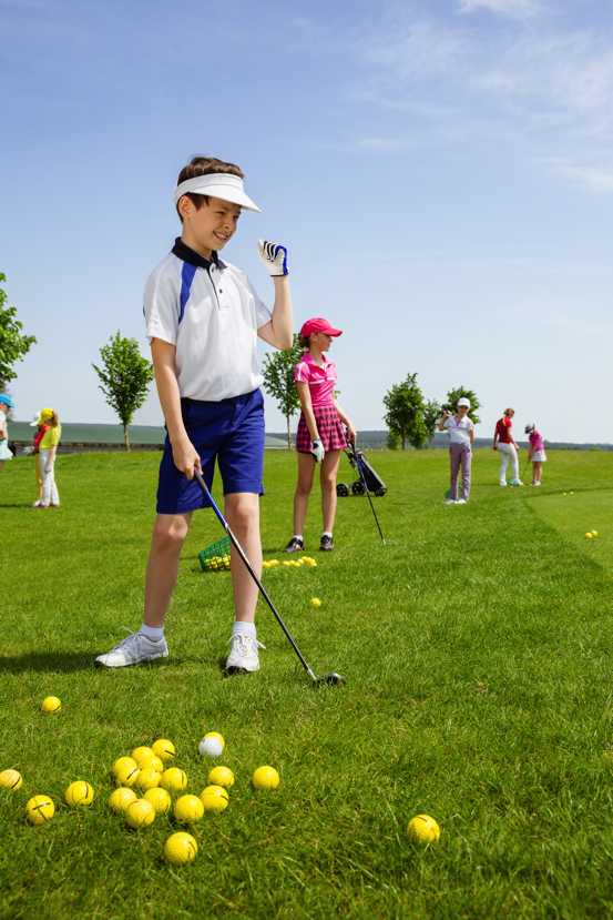 Boy playing golf
